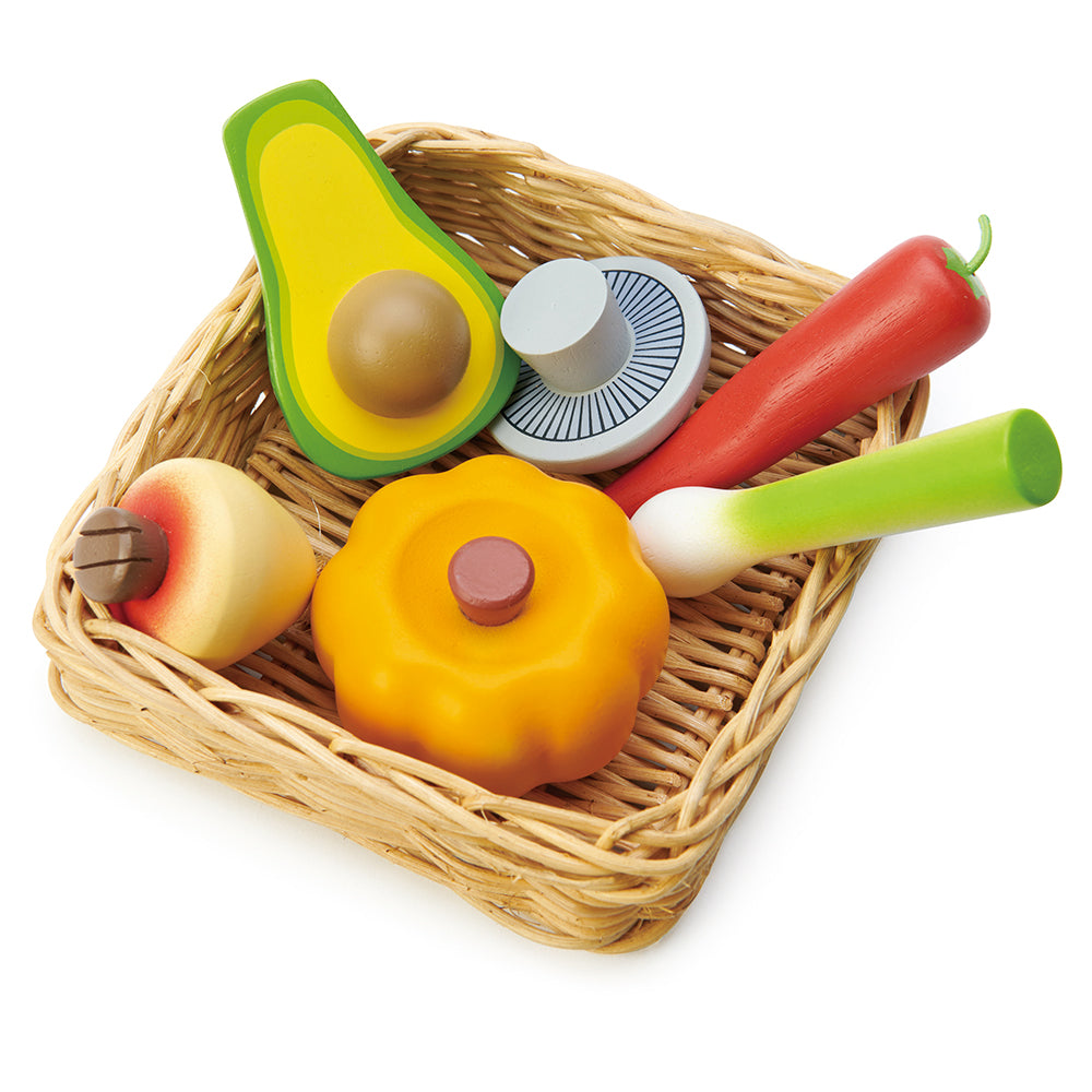 A super healthy veggie basket to be played with our market stall. A hand crafted wicker basket filled with a pumpkin, turnip, mushroom, chilli pepper, avocado, and leek.  Part of our Market day Range and an accessory to our gorgeous Farmers Market.