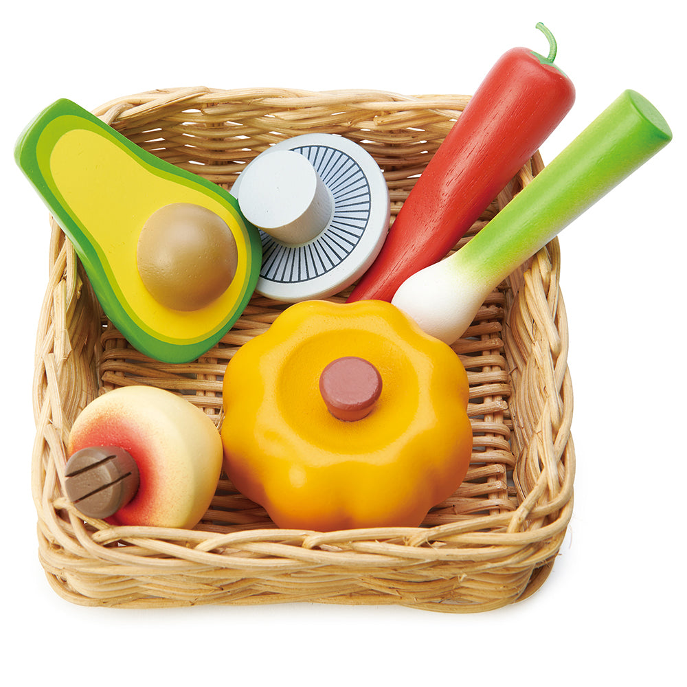 A super healthy veggie basket to be played with our market stall. A hand crafted wicker basket filled with a pumpkin, turnip, mushroom, chilli pepper, avocado, and leek.  Part of our Market day Range and an accessory to our gorgeous Farmers Market.