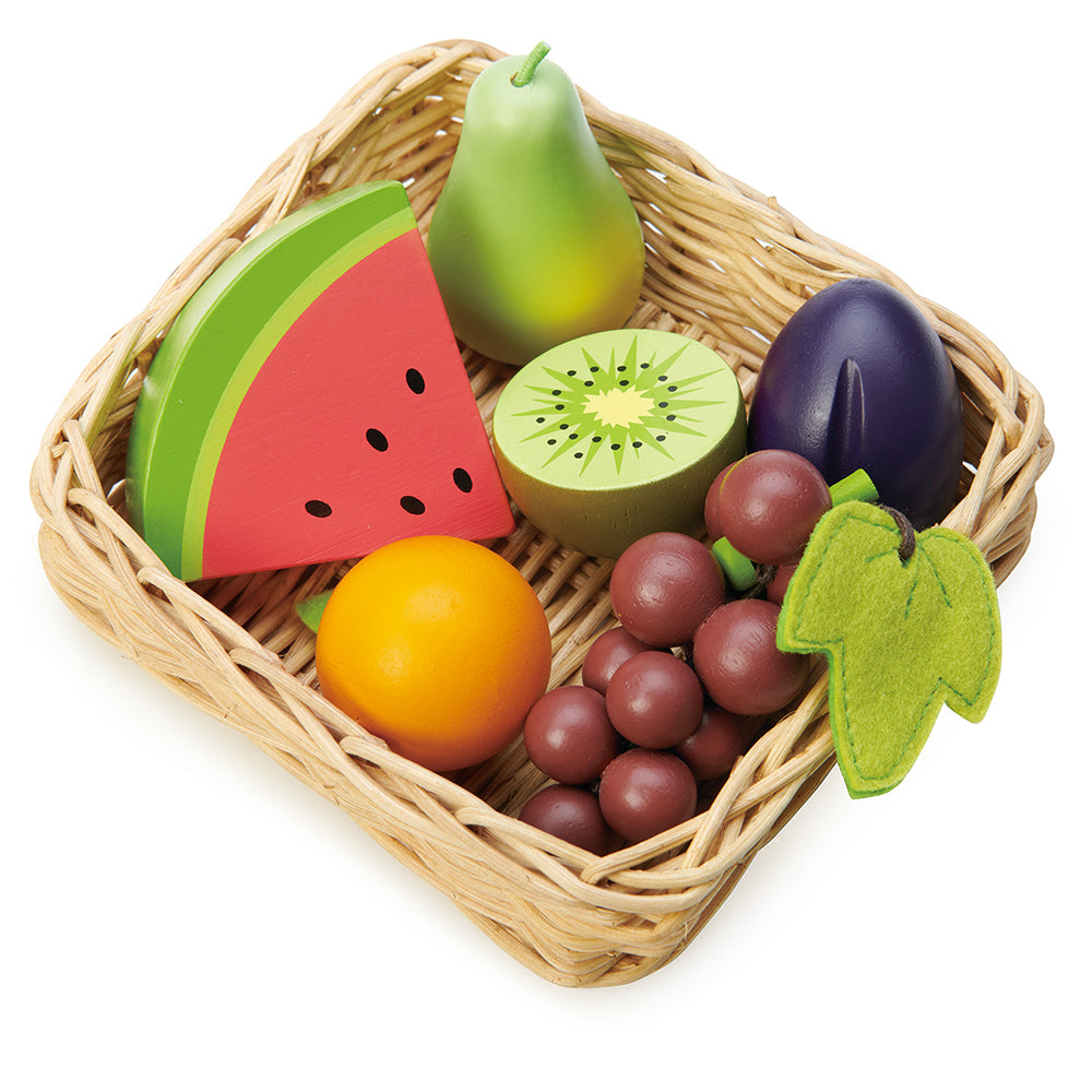 A selection of fruits from round the world, all in a hand crafted wicker basket, Set includes, bunch of grapes, half a kiwi fruit, slice of watermelon, pear, plum, and tangerine. Part of our Market day Range and an accessory to our Farmers Market.