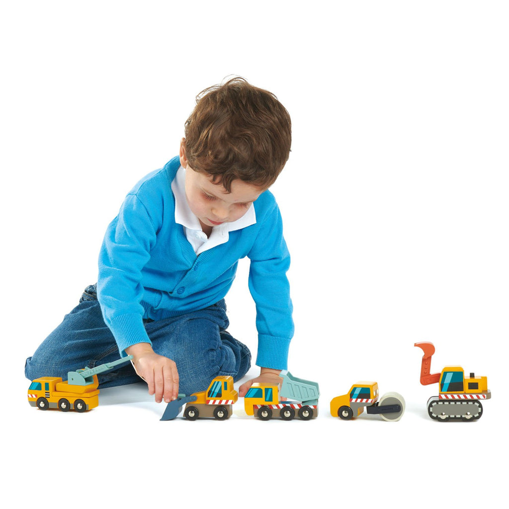 Tender Leaf Toys wooden vehicles construction site, including dump truck, front loader, digger, crane truck, road roller. All with moving parts