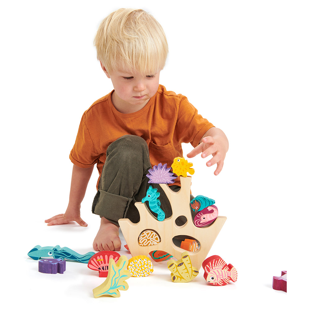 completely plastic free toy wooden stacking under the sea coral rock sea creatures including a shrimp, a squid, a crab, two eels, a sea urchin, a sea anenome, a starfish, a seahorse, three fish, four coral pieces, and a hermit crab.