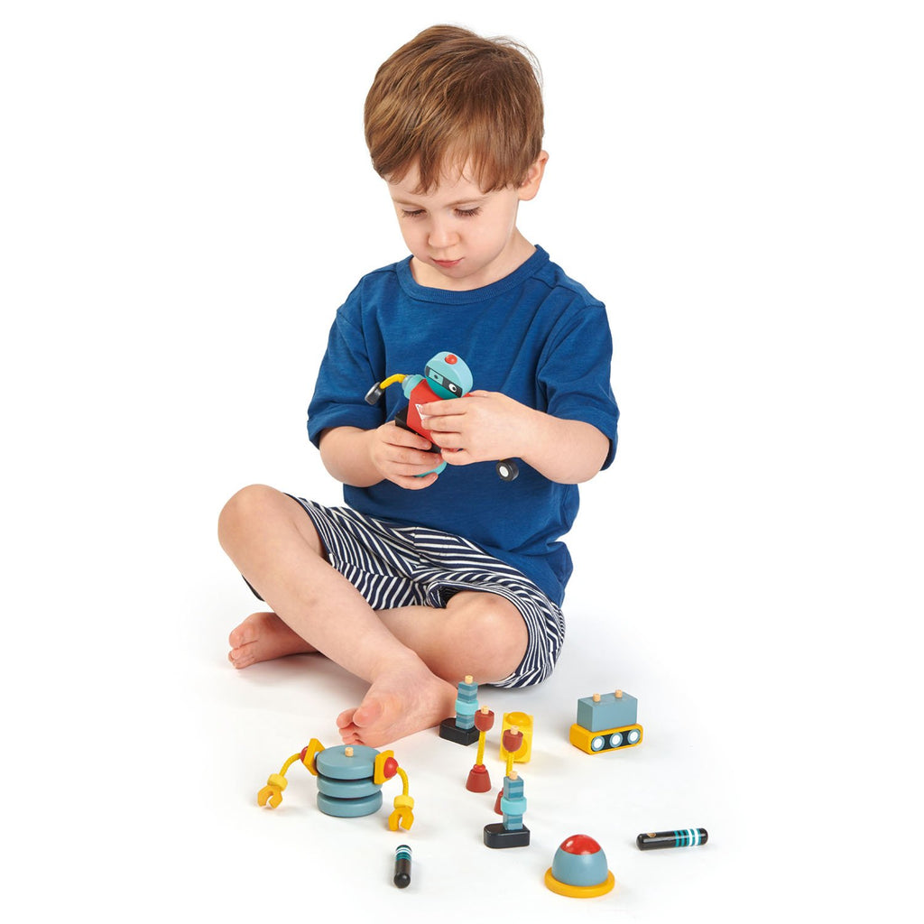 Tender Leaf Toys wooden robot construction set includes 3 brightly coloured and retro style robots that all come apart so that they can be reconstructed in a variety of ways for creative play