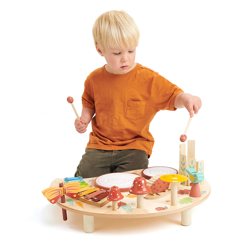 Tenderleaf wooden music tray table for children with drums bells and lots of accessories. Woodland rainbow theme