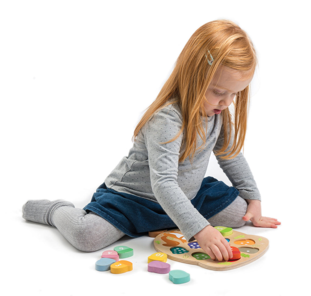 Tender Leaf Toys wooden counting game to educate toddlers. 10 numbered acorn puzzle pieces designed for child development and learning through playTender Leaf Toys wooden counting game to educate toddlers. 10 numbered acorn puzzle pieces designed for child development and learning through play
