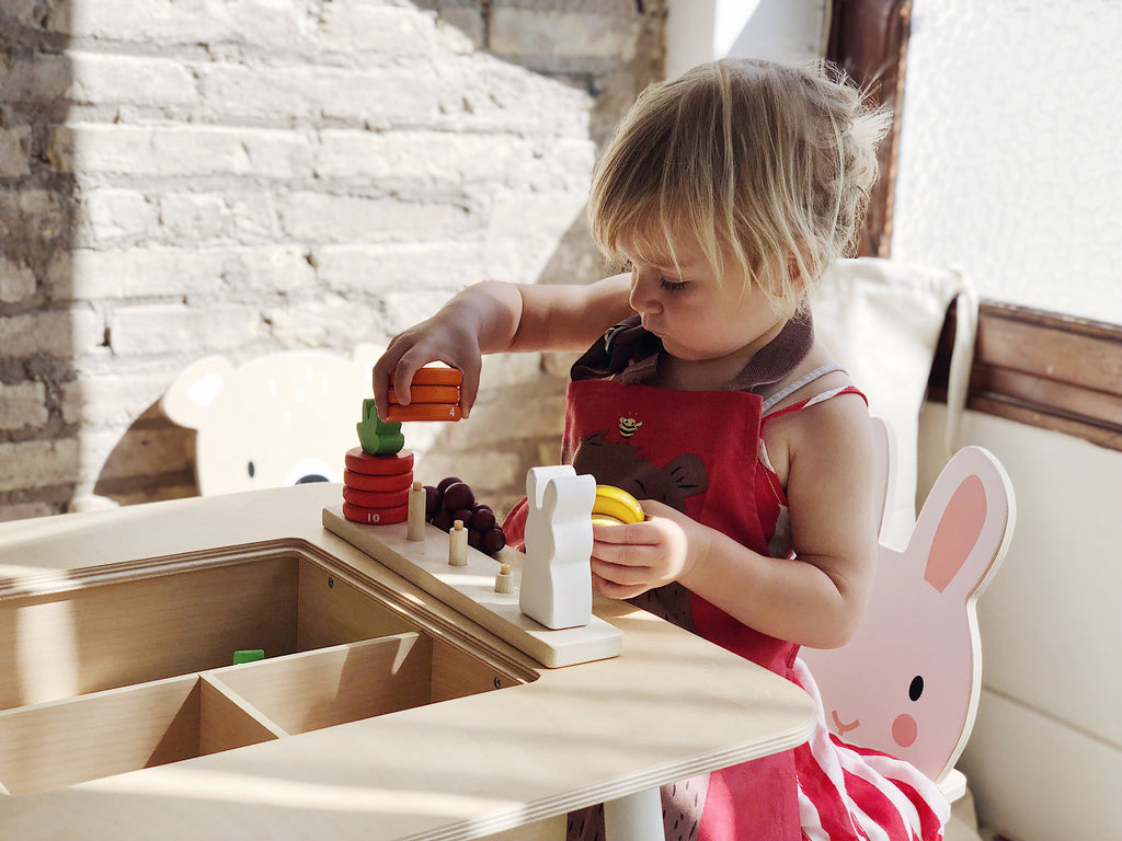 Tender Leaf Toys wooden counting game to educate toddlers. 10 numbered stacking rings designed for child development and learning through play